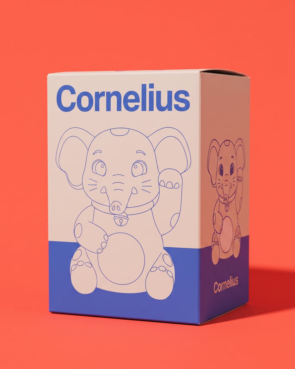 The Cornelius packaging box: bone white with a cobalt line drawing of the elephant and a cobalt band